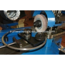 Spiral wound ring polish machine